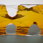 Formation glass sculpture by Bill Meek, amber-yellow sculpted glass blocks on a clear base.