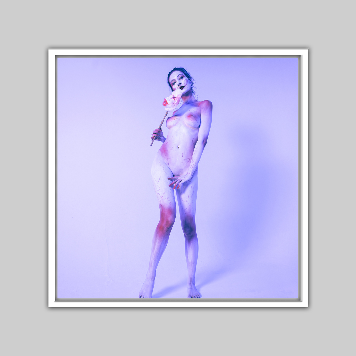 Print: The Mask by Paul Roustan, nude figure in blue-purple body paint holding a pale mask