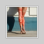 Red Boots photograph by VEFA Gallery: legs with red geometric body paint against a white and blue wall.